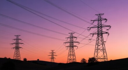 Fototapeta premium Photo of a silhouette of power lines against a vibrant sunset sky, showcasing the infrastructure and technology of electricity transmission and the high voltage cables that supply energy