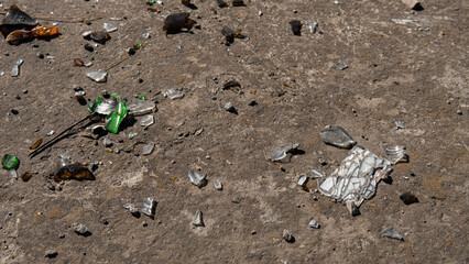 Broken glass shards on asphalt close-up