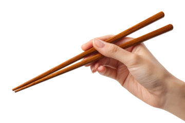 A hand holds wooden chopsticks