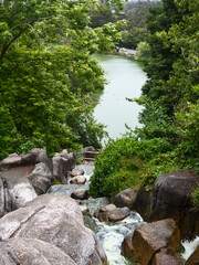 A waterfall flowing into a lake. 