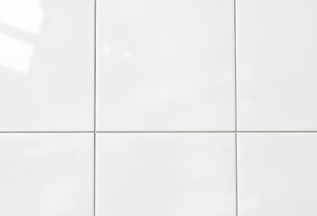 Subtle linear pattern on glossy white ceramic tile, seamless background,  backdrop,  geometric