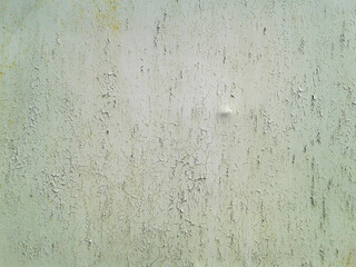 Old green light painted metal with rust spots and cracks. Grunge texture.
