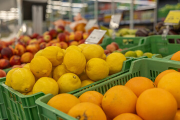 fresh summer fruits and vegetables in the supermarket on the shelf.