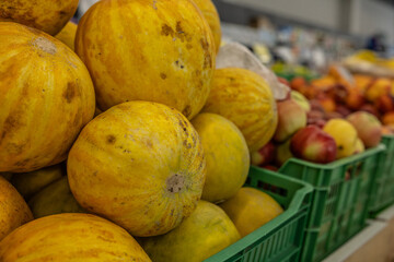 fresh summer fruits and vegetables in the supermarket on the shelf.