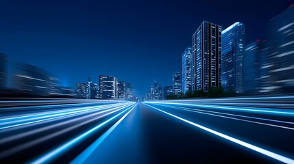 Blurred motion of an illuminated urban street at night, surrounded by a futuristic city skyline of modern skyscrapers and buildings