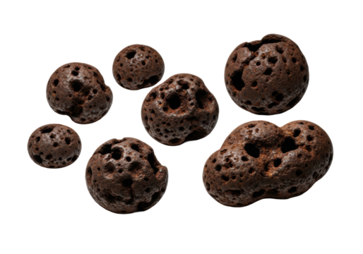 Opaque dark rust-colored oxidized cast iron forms with deeply pitted textures and flaky surfaces, macro shot on transparent background with harsh studio light, concept of industrial decay.