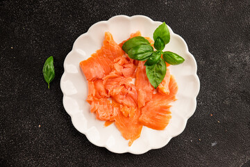 Smoked salmon fish seafood portion size natural product tasty snack fresh delicious gourmet food background on the table rustic top view copy space pescetarian diet