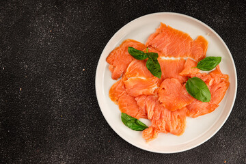 Smoked salmon fish seafood portion size natural product tasty snack fresh delicious gourmet food background on the table rustic top view copy space pescetarian diet