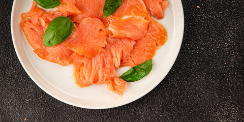 Smoked salmon fish seafood portion size natural product tasty snack fresh delicious gourmet food background on the table rustic top view copy space pescetarian diet