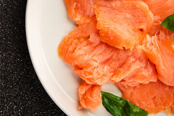 Smoked salmon fish seafood portion size natural product tasty snack fresh delicious gourmet food background on the table rustic top view copy space pescetarian diet