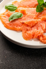 Smoked salmon fish seafood portion size natural product tasty snack fresh delicious gourmet food background on the table rustic top view copy space pescetarian diet