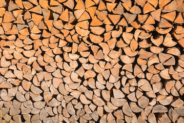 neatly stacked logs for drying for firewood storage