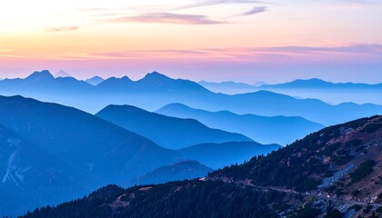 Obraz premium Panoramic view of mountain ranges at sunrise