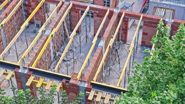 Office Building Construction Site with Formwork Support Beams and Cinderblock Airbrick Walls