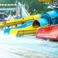 Water slides in a park during rain