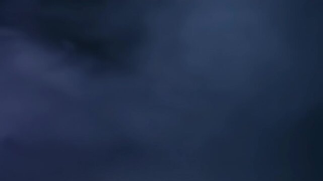 billowing white smoke expanding over black background