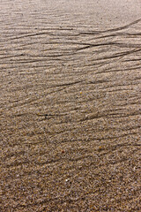 Close-up of sand with wave-like patterns