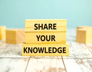 Wooden blocks stacked, displaying the phrase "Share Your Knowledge