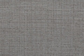 Wallpaper with a dark gray jute fabric texture and visible voluminous threads