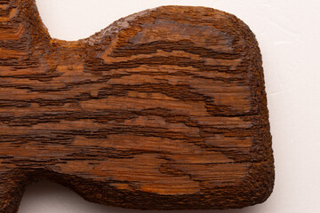 Mahogany serving board for displaying appetizers, macro shot, top view of handle