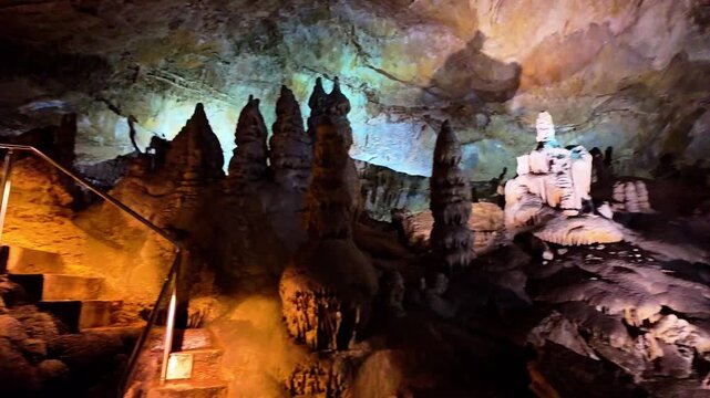 A scenic and illuminated view of the caverns inside Lewis and Clark Caverns State Park is captured, highlighting the stunning geological formations and the unique lighting that enhances their beauty