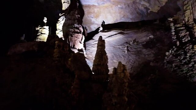 A scenic and illuminated view of the caverns inside Lewis and Clark Caverns State Park is captured, highlighting the stunning geological formations and the unique lighting that enhances their beauty