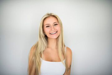 Pretty 18 years old blonde girl posing in studio