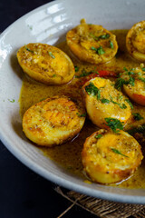 Traditional Bengali egg malaicurry or dim malaikari, boiled eggs cooked in rich coconut milk gravy with spices, authentic Indian curry from Bengal cuisine served with steamed rice as festive meal
