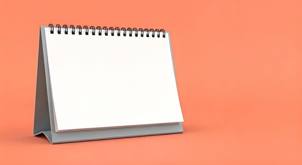 Blank calendar on peach background for scheduling and planning.
