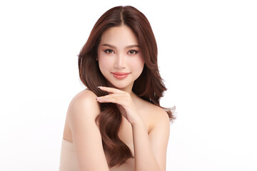 Fototapeta premium A beautiful young Asian woman with clean, fresh skin against a white background. Skincare, facial treatment, cosmetology, beauty, and spa. An elegant portrait of an Asian woman.