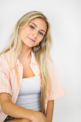 Naklejka premium Pretty 18 years old blonde girl posing in studio
