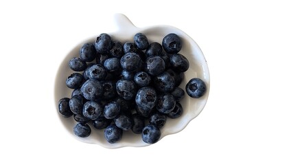 blueberries in a plate isolated on white background