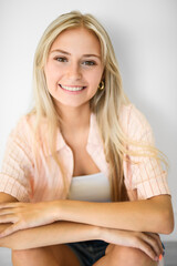 Naklejka premium Pretty 18 years old blonde girl posing in studio
