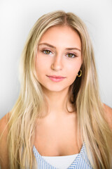 Naklejka premium Pretty 18 years old blonde girl posing in studio