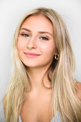 Naklejka premium Pretty 18 years old blonde girl posing in studio