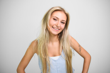 Fototapeta premium Pretty 18 years old blonde girl posing in studio