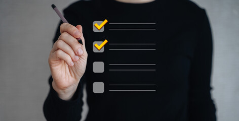 A businessman uses a pen to mark a checkbox for document quality control.