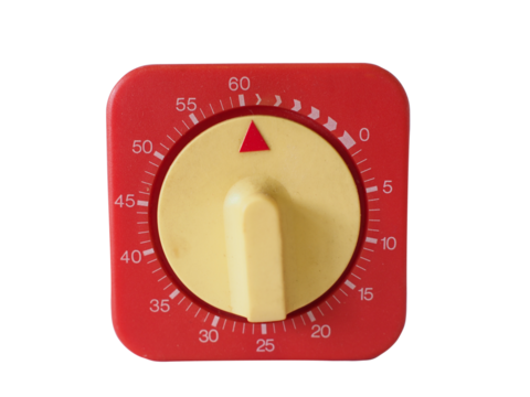 Close-up of a red mechanical timer with yellow dial, used for cooking or laboratory timing.