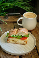 sandwich with cheese, tomatoes and lettuce
