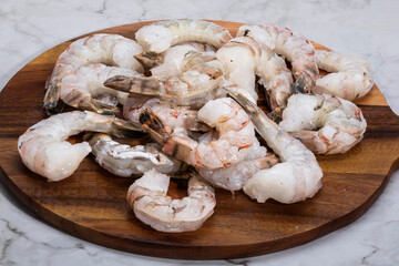 raw shrimp on wooden table