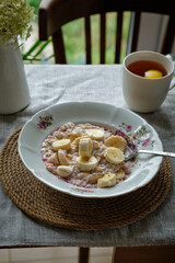 Breakfast. Oatmeal with cherry jam and banana. Tea with lemon.