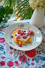 pumpkin waffles with cream and berries