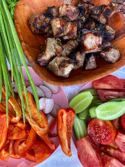 Shish kebab with different vegetables on a plate. Barbecue party outdoor. Food background.