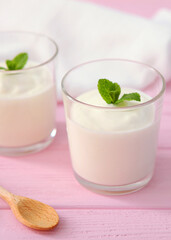 Natural white yogurt on the table. Healthy snack, Greek yogurt.. Vertical photo format