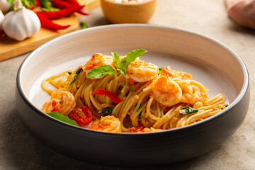 Spicy Stir Fried pasta seafood,Thai Spicy stir fried spaghetti with shrimp and basil leaves,Pad Kra Pao kung.Thai fusion food.