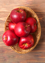 ripe juicy red apples on the table.. Vertical photo format