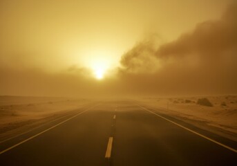 Naklejka premium Desert road obscured by sandstorm dust
