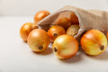 Onion on the kitchen table. onion slice. onion rings. Fresh Yellow Onion. Natural, fresh, vegetarian food. Agricultural products. Healthy eating. Vegetables. Farmer's market. Space for text.Copy space