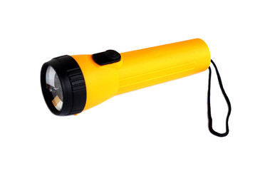 Bright yellow handheld flashlight with black head and wrist strap isolated on white background. Portable emergency light source for camping, outdoor activities, or power outage situations.