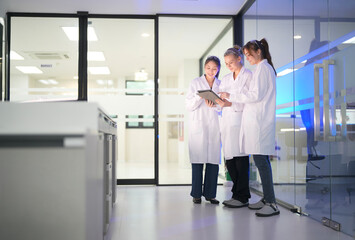 Laboratory team collaborates on research findings in modern medical facility